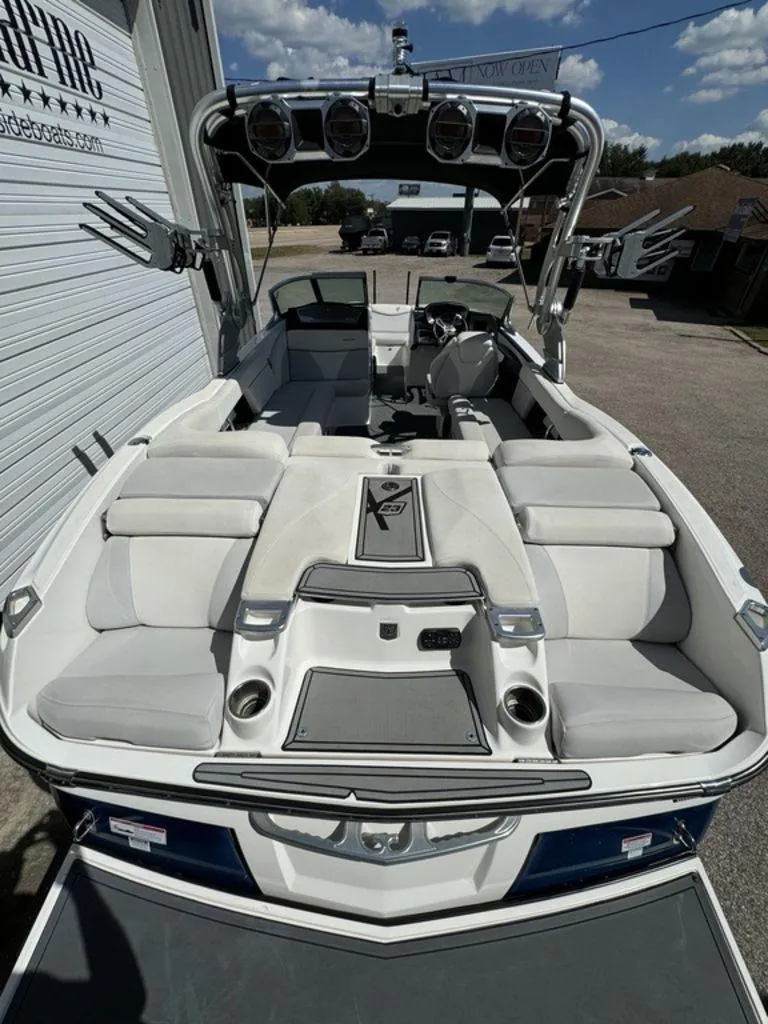 Slide: The Image of 2018 MasterCraft X23 boat interior with white seating and wakeboard tower. - 5