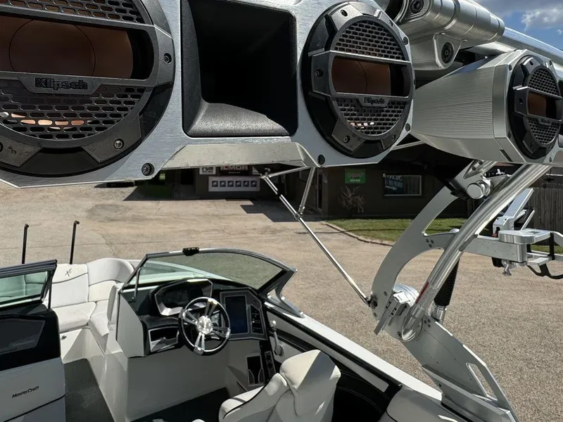 Slide: The Image of 2018 MasterCraft X23 boat interior with Klipsch speakers and sleek design. - 6