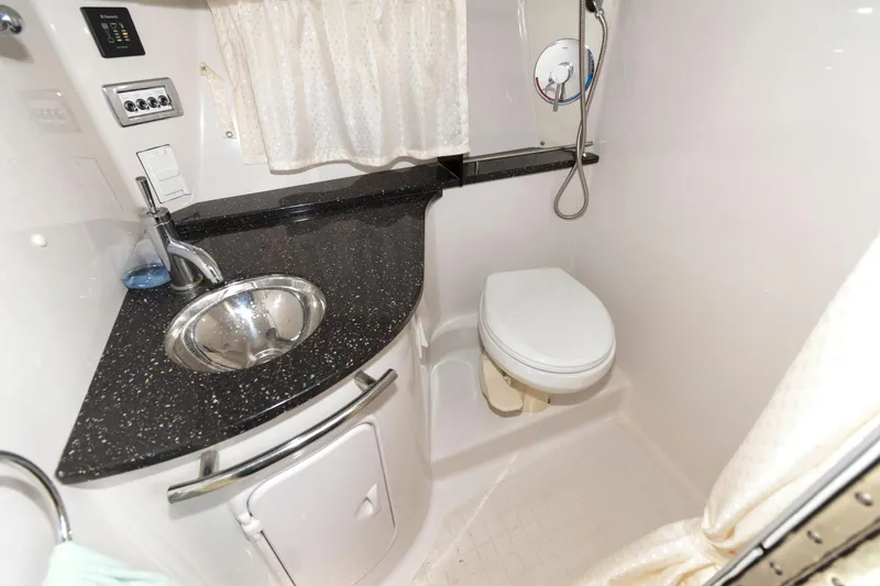 Slide: The Image of 2008 Four Winns V338 boat bathroom with sink, toilet, and shower. - 16