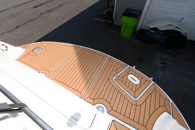 Slide: The Image of 2008 Four Winns V338 boat deck with wood finish, viewed from above. - 3