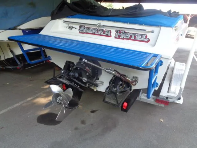 Slide: The Image of 2001 Warlock 29 World Class boat with "Sierra Hotel" branding, parked on a trailer. - 15