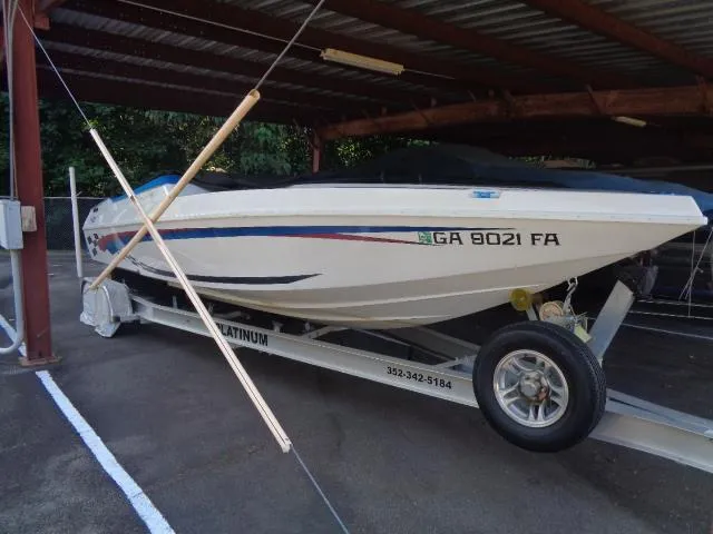 Slide: The Image of 2001 Warlock 29 World Class boat on trailer under shelter. - 19