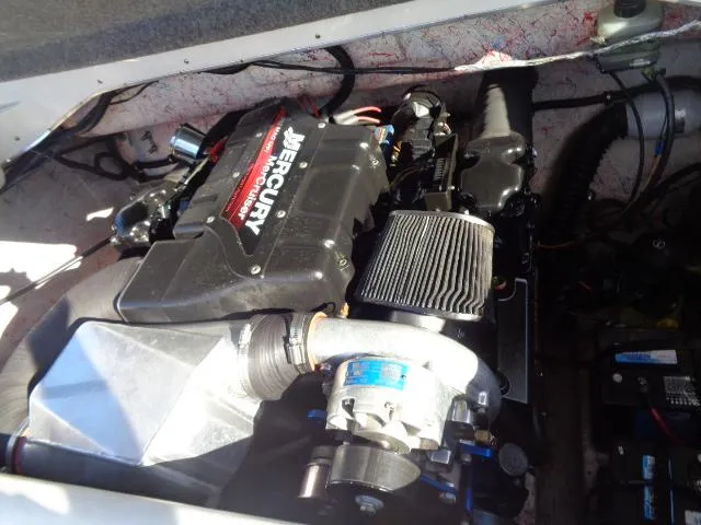 Slide: The Image of Engine compartment of a 2001 Warlock 29 World Class boat with Mercury engine. - 20