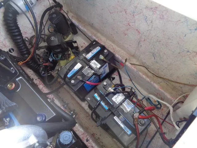 Slide: The Image of Battery compartment of a 2001 Warlock 29 World Class boat with wiring and components. - 23