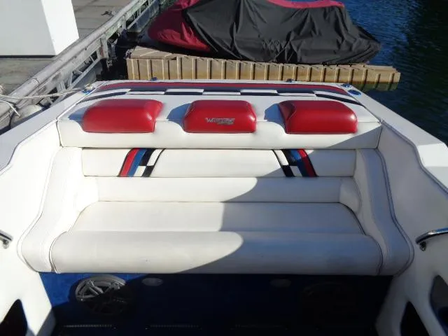 Slide: The Image of 2001 Warlock 29 World Class boat interior with red and white seating. - 8