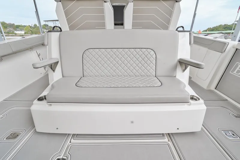 Slide: The Image of 2021 Pursuit S 428 Sport boat with cushioned seating and sleek design. - 14