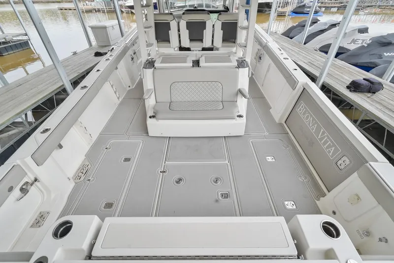 Slide: The Image of 2021 Pursuit S 428 Sport boat interior with spacious deck and seating. - 17