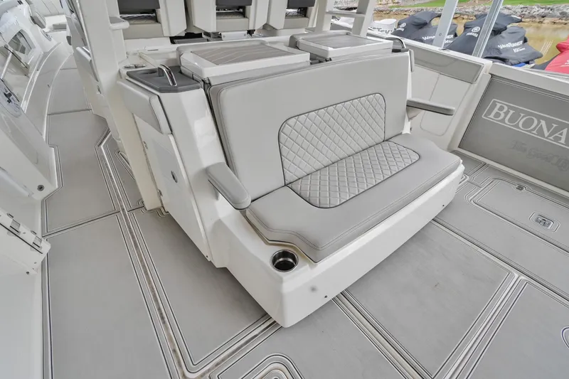 Slide: The Image of 2021 Pursuit S 428 Sport boat interior with cushioned seating and sleek design. - 18