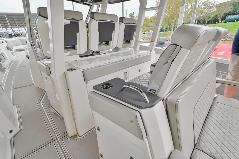 Slide: The Image of Interior of 2021 Pursuit S 428 Sport boat with luxurious seating and modern design. - 21