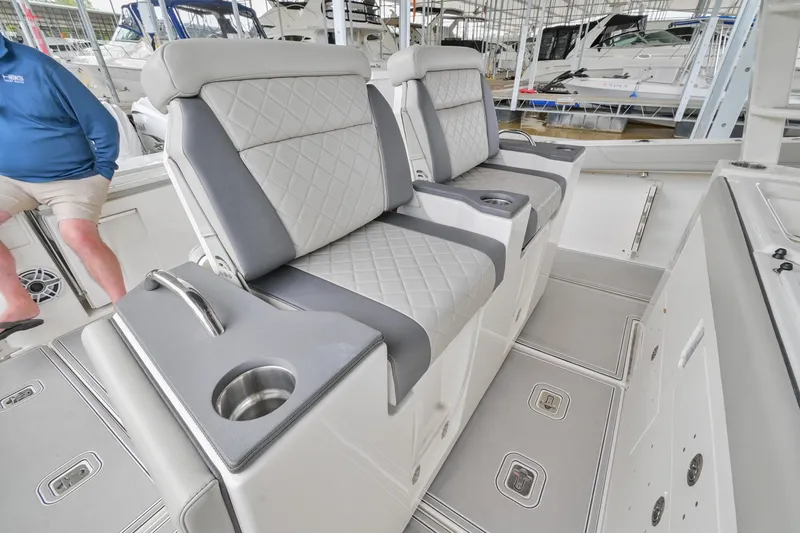 Slide: The Image of 2021 Pursuit S 428 Sport boat interior with luxurious seating and cup holders. - 27
