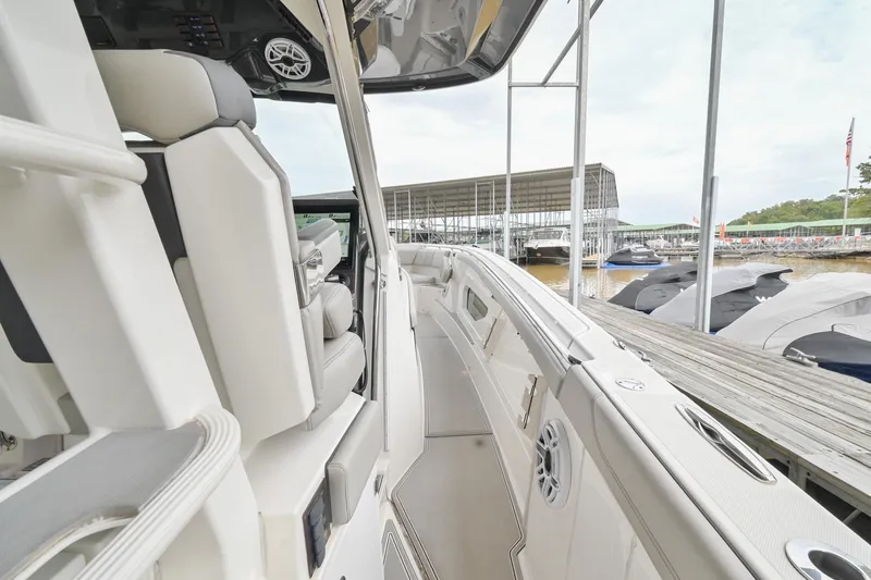 Slide: The Image of 2021 Pursuit S 428 Sport boat interior at marina dock. - 28