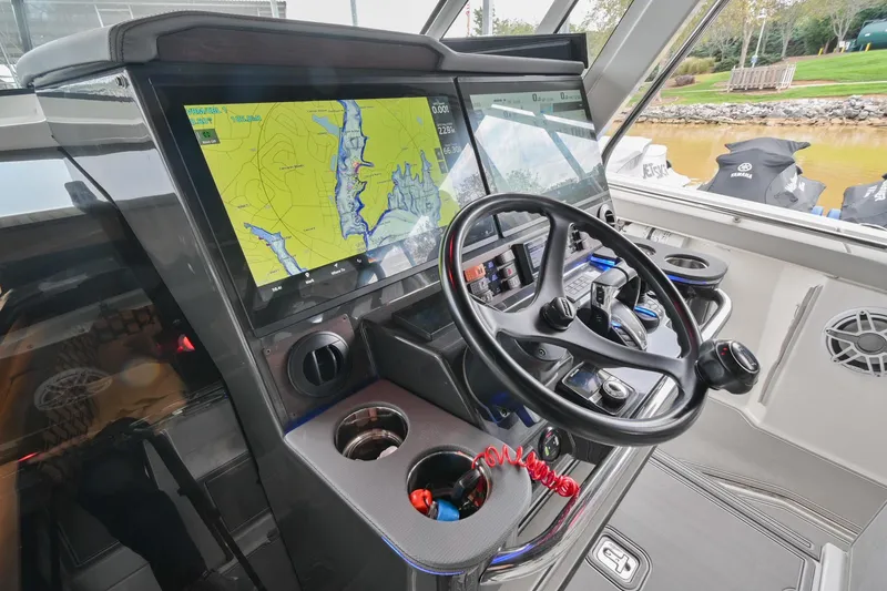 Slide: The Image of 2021 Pursuit S 428 Sport helm with navigation display and steering wheel. - 34