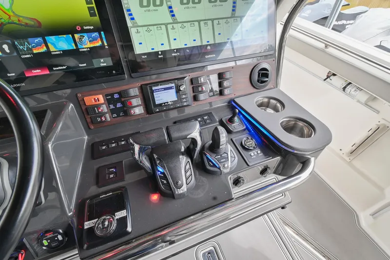 Slide: The Image of Control panel of 2021 Pursuit S 428 Sport boat with advanced navigation and controls. - 35