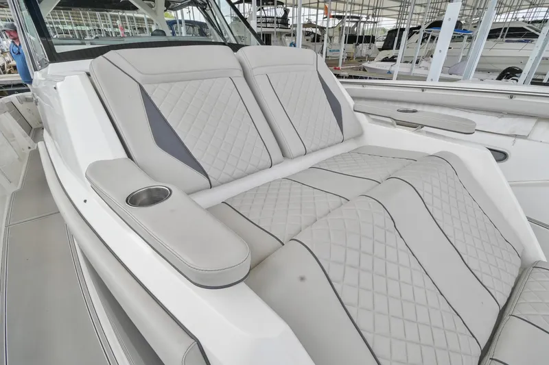 Slide: The Image of Luxurious seating on 2021 Pursuit S 428 Sport boat with quilted upholstery and cup holder. - 42