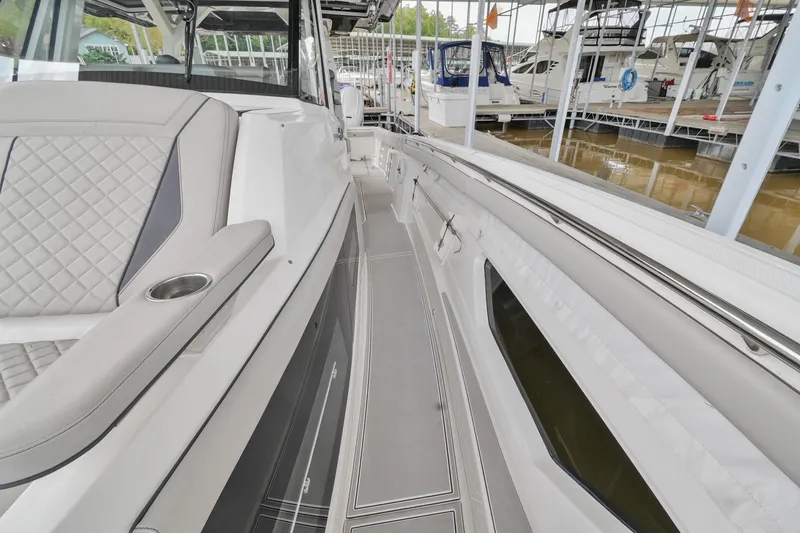 Slide: The Image of 2021 Pursuit S 428 Sport boat interior with sleek seating and modern design. - 48