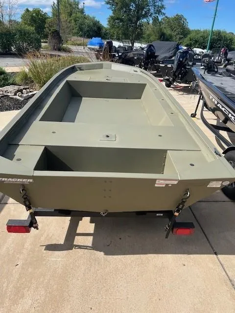 Slide: The Image of 2025 Tracker Grizzly 1754 Jon boat on display outdoors. - 2