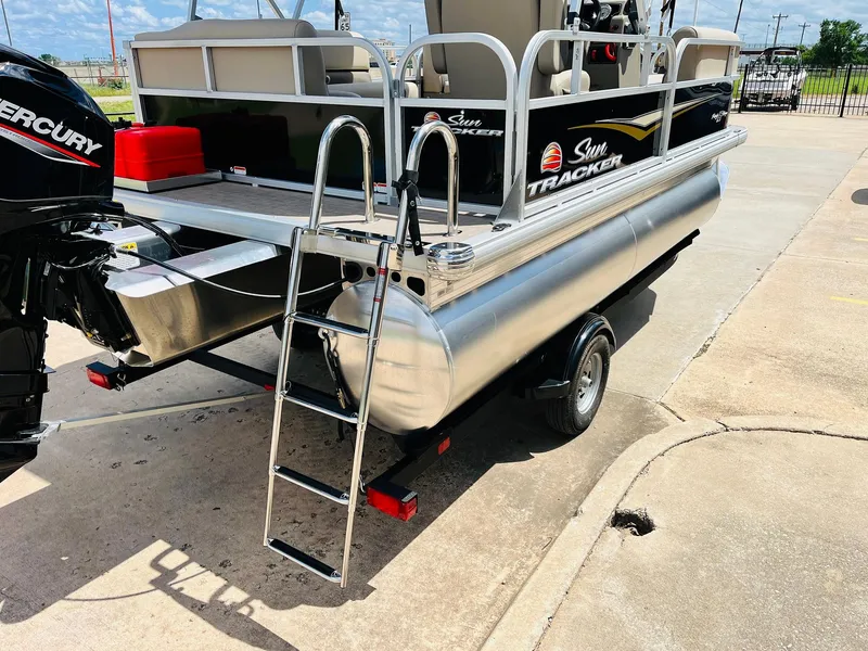 Slide: The Image of 2025 Sun Tracker Party Barge 16 DLX pontoon boat with ladder and Mercury engine. - 10