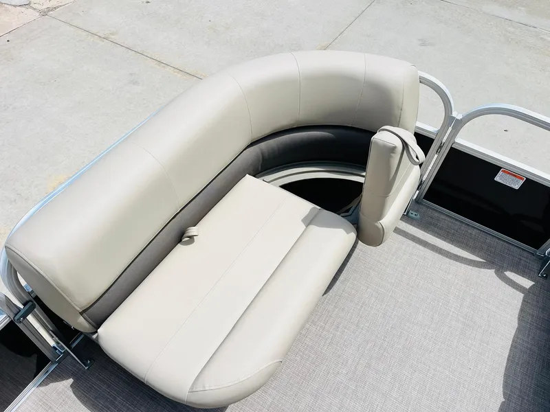 Slide: The Image of 2025 Sun Tracker Party Barge 16 DLX seating area with beige upholstery. - 15