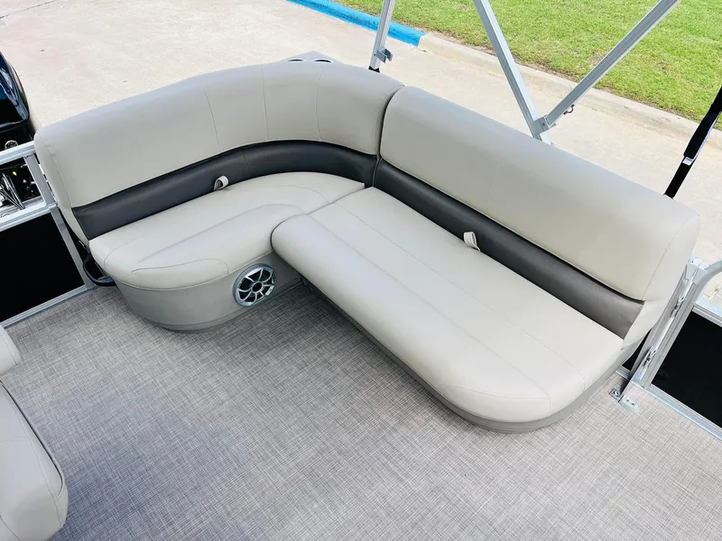 Slide: The Image of 2025 Sun Tracker Party Barge 16 DLX interior seating with gray upholstery. - 27