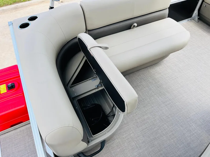 Slide: The Image of 2025 Sun Tracker Party Barge 16 DLX interior with storage compartment open. - 29