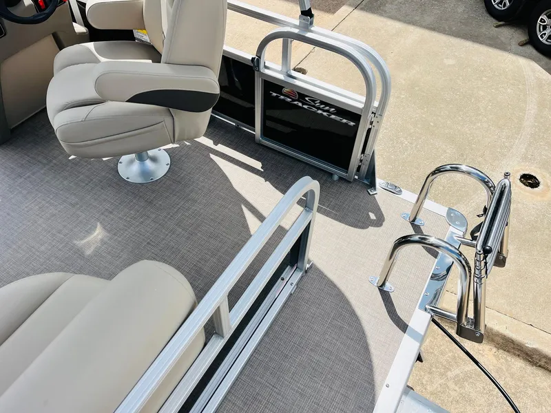 Slide: The Image of 2025 Sun Tracker Party Barge 16 DLX interior with seating and railing details. - 34