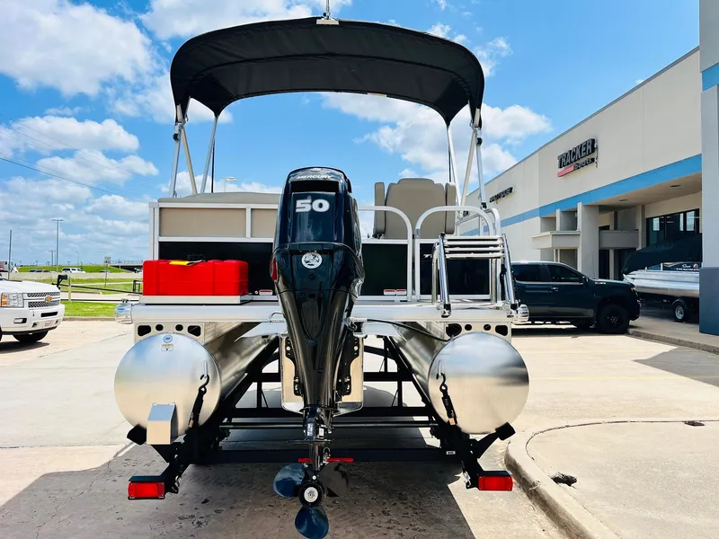 Slide: The Image of 2025 Sun Tracker Party Barge 16 DLX pontoon boat with 50 HP engine at dealership. - 7