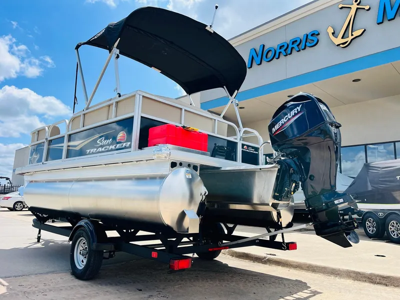 Slide: The Image of 2025 Sun Tracker Party Barge 16 DLX with Mercury engine at dealership. - 8