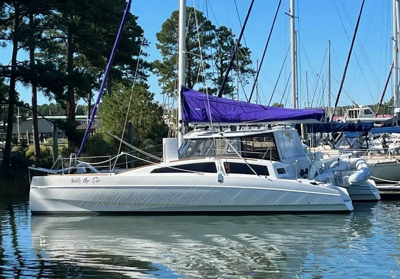 The Image of 2018 Maine Cat 38 Electric catamaran docked with purple sail cover. - 0