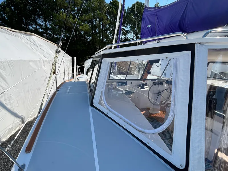 Slide: The Image of 2018 Maine Cat 38 Electric sailboat with visible cockpit and steering wheel. - 14