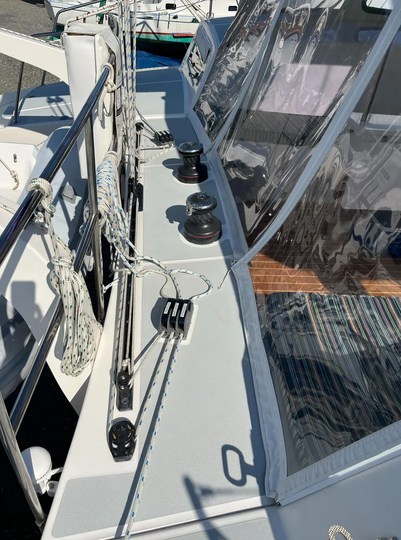 Slide: The Image of 2018 Maine Cat 38 Electric sailboat deck with winches and rigging. - 20