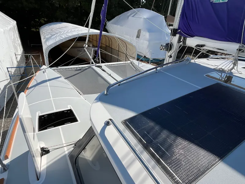 Slide: The Image of 2018 Maine Cat 38 Electric catamaran with solar panels and sleek deck design. - 21