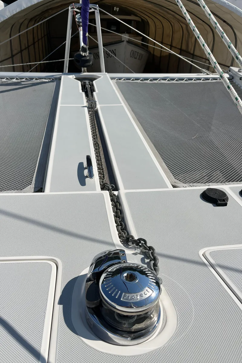 Slide: The Image of 2018 Maine Cat 38 Electric catamaran deck with winch and chain detail. - 25
