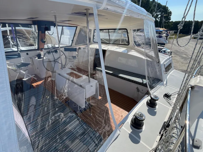 Slide: The Image of 2018 Maine Cat 38 Electric sailboat interior with modern cockpit and navigation equipment. - 33
