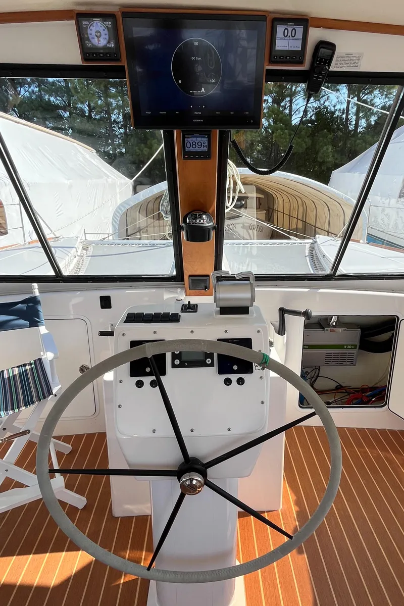 Slide: The Image of Helm of 2018 Maine Cat 38 Electric with steering wheel and navigation display. - 36