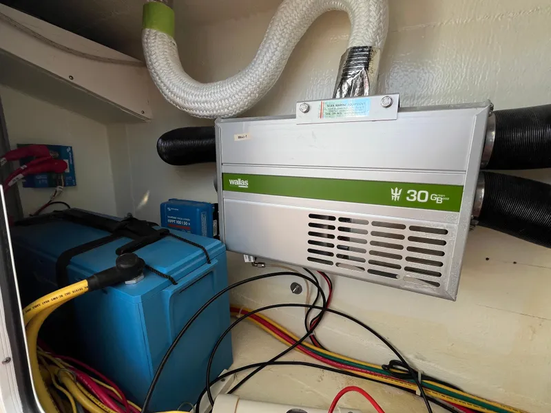 Slide: The Image of Electrical system inside a 2018 Maine Cat 38 Electric boat, featuring wiring and components. - 41