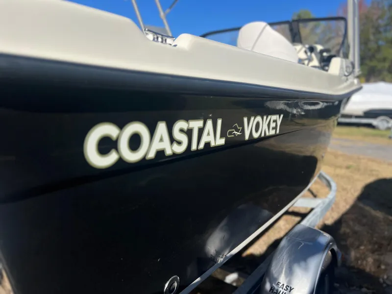 Slide: The Image of 2024 Coastal 198 WT boat with "Coastal Vokey" branding on the side. - 4