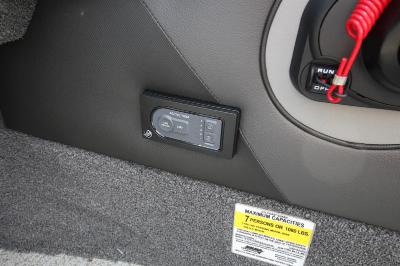 Slide: The Image of 2024 Lund 1775 Crossover XS interior control panel and capacity label. - 11