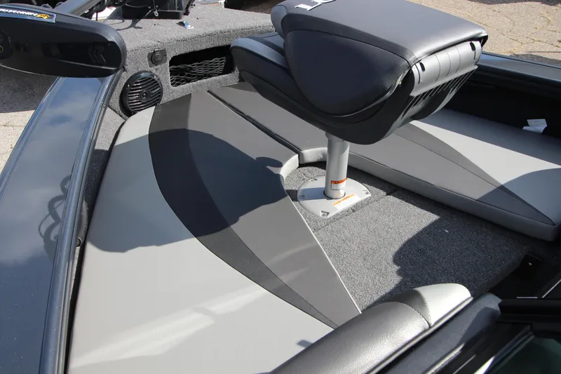 Slide: The Image of 2024 Lund 1775 Crossover XS boat interior with seating and carpeted flooring. - 12