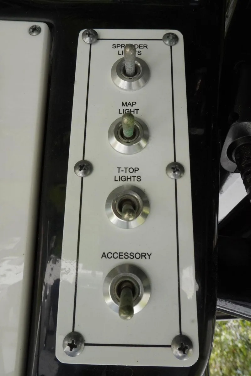 Slide: The Image of Switch panel on 2021 Sea Pro 219 boat with labeled light controls. - 15