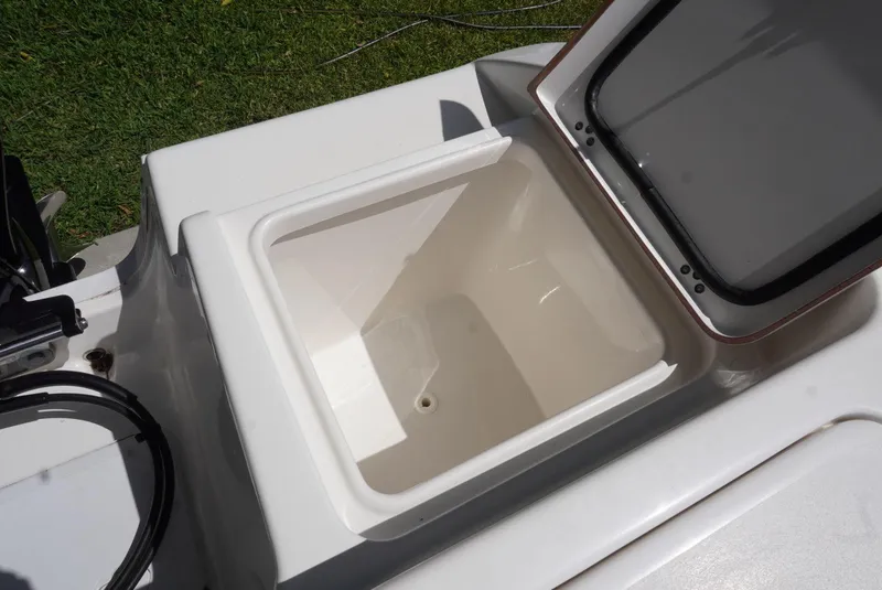 Slide: The Image of Open storage compartment on 2021 Sea Pro 219 boat, showing interior details. - 16