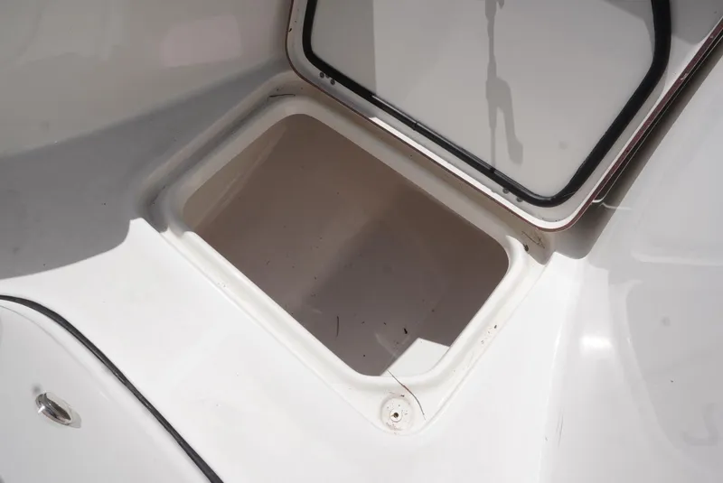 Slide: The Image of Open storage compartment on 2021 Sea Pro 219 boat. - 18