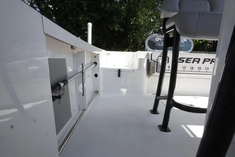 Slide: The Image of 2021 Sea Pro 219 boat interior with seating and storage compartments. - 23