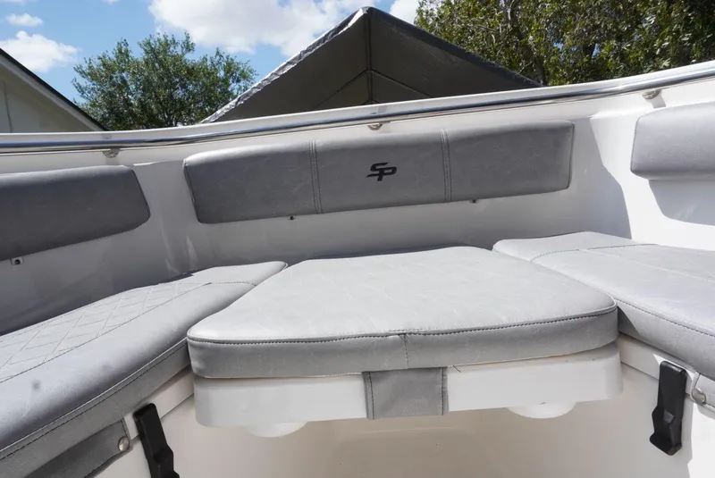 Slide: The Image of 2021 Sea Pro 219 boat interior with gray cushioned seating. - 25