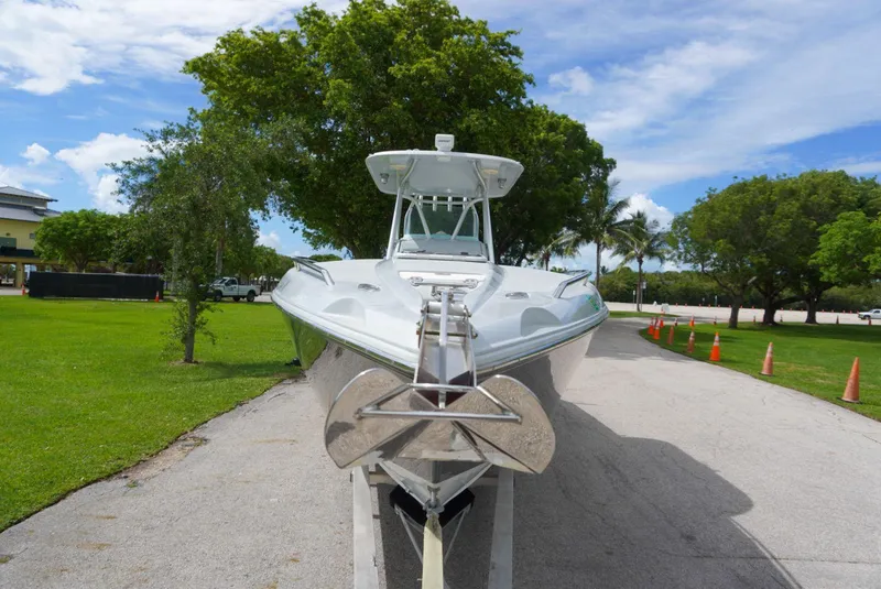 Slide: The Image of 2004 Baja 340 Sportfish boat on trailer, parked on a sunny day. - 15