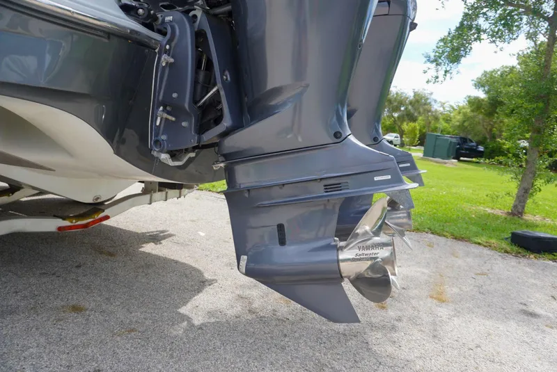 Slide: The Image of 2004 Baja 340 Sportfish outboard motor and propeller on a trailer. - 21