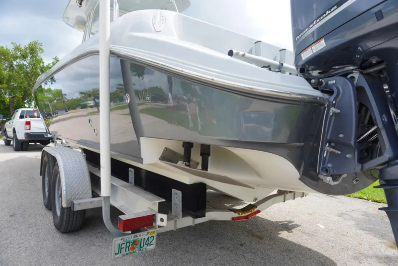 Slide: The Image of 2004 Baja 340 Sportfish boat on trailer, rear view with outboard motor. - 25