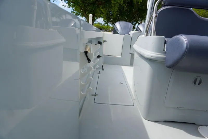 Slide: The Image of 2004 Baja 340 Sportfish boat interior with seating and storage compartments. - 31