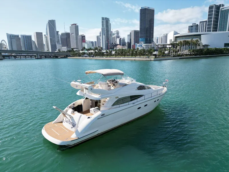 Slide: The Image of Luxury 2003 Aicon 56 yacht cruising in urban waterfront setting. - 10