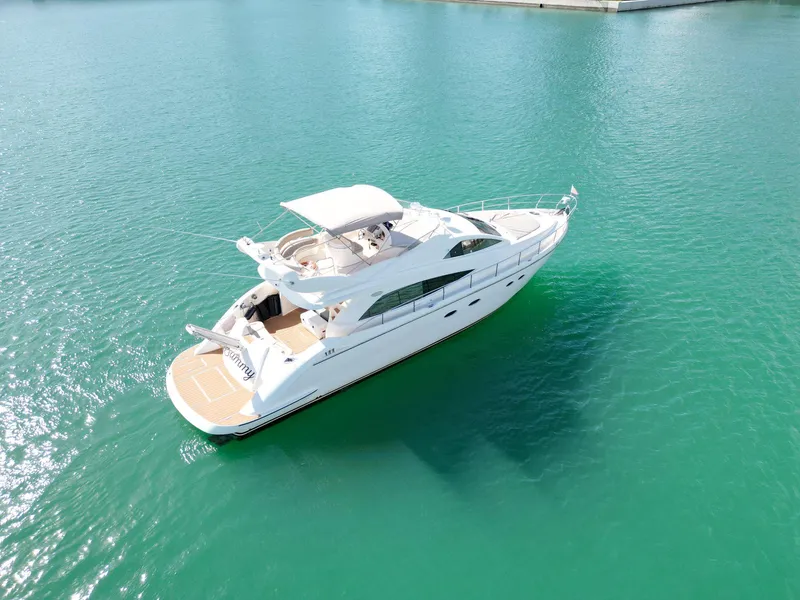 Slide: The Image of Aerial view of 2003 Aicon 56 yacht on turquoise water. - 12