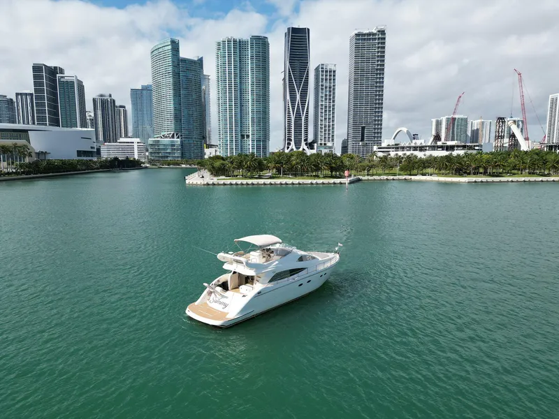 Slide: The Image of Luxury Aicon 56 yacht cruising near city skyline, 2003 model. - 19